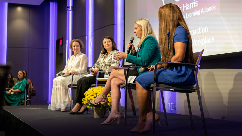Group of businesswomen on stage at event